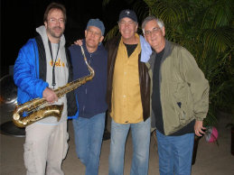 Coral Reefer Band members Tom TC Mitchell, Greg Fingers Taylor, Doyle Grisham with Jimmy Buffett tribute artist Barrie Cunningham